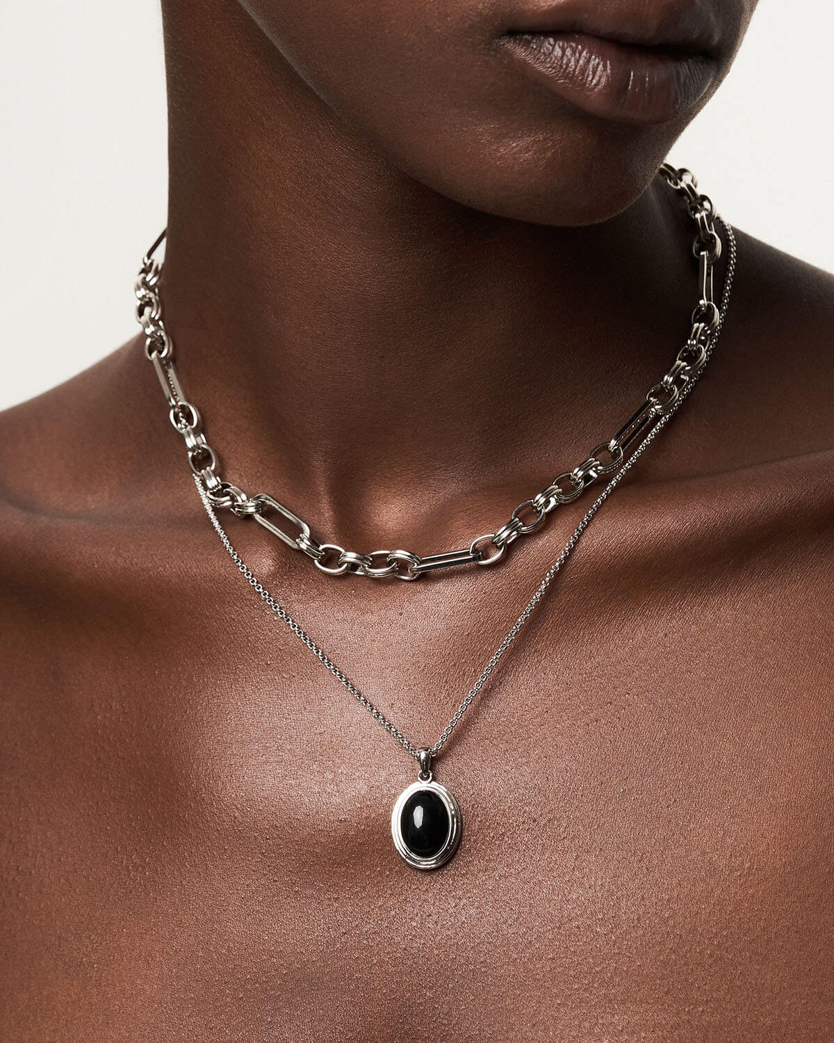 a close up of a person wearing a necklace