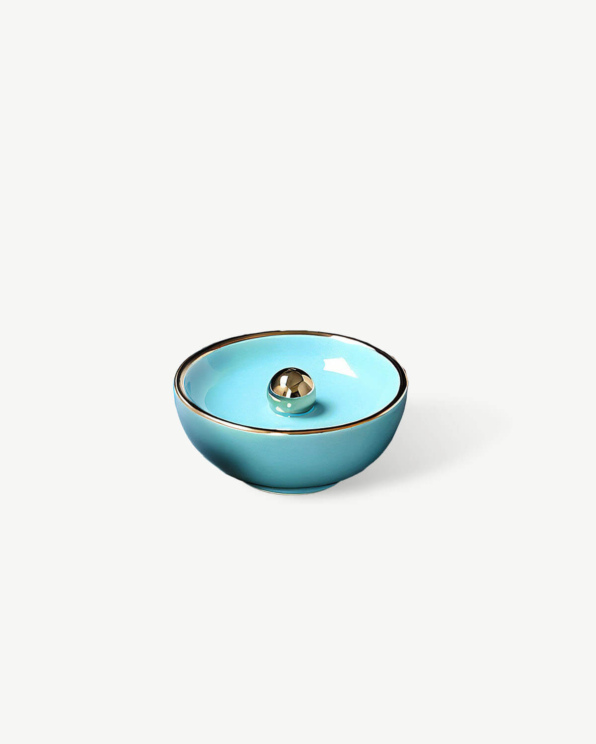 a blue bowl with a metal handle on a white background