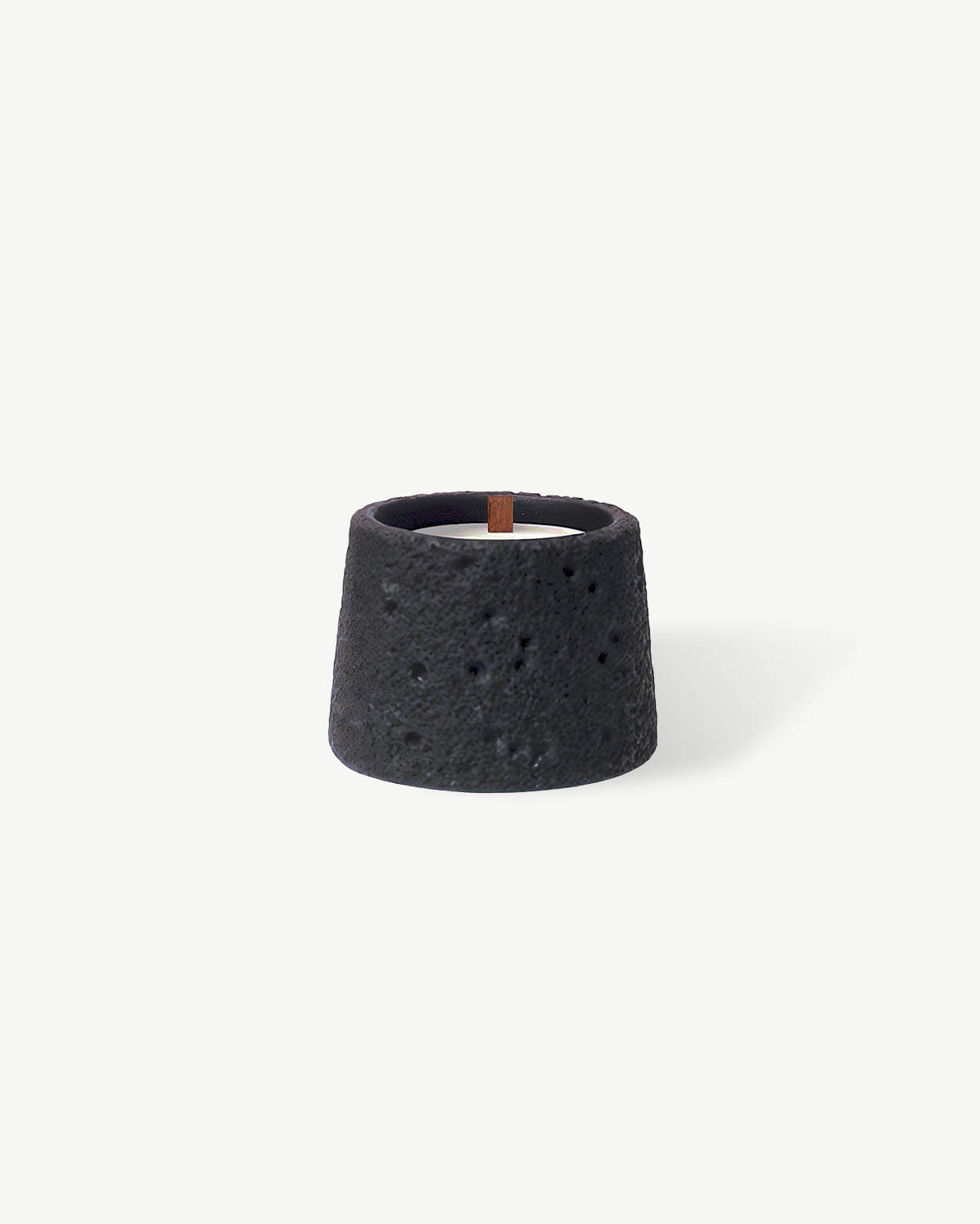 a black ceramic candle holder on a white background