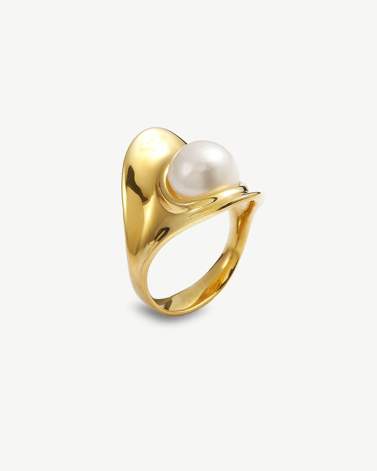 a gold ring with a white pearl