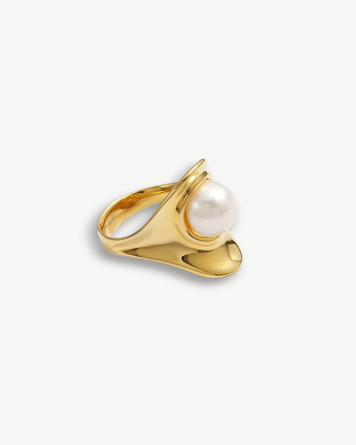 a gold ring with a white pearl