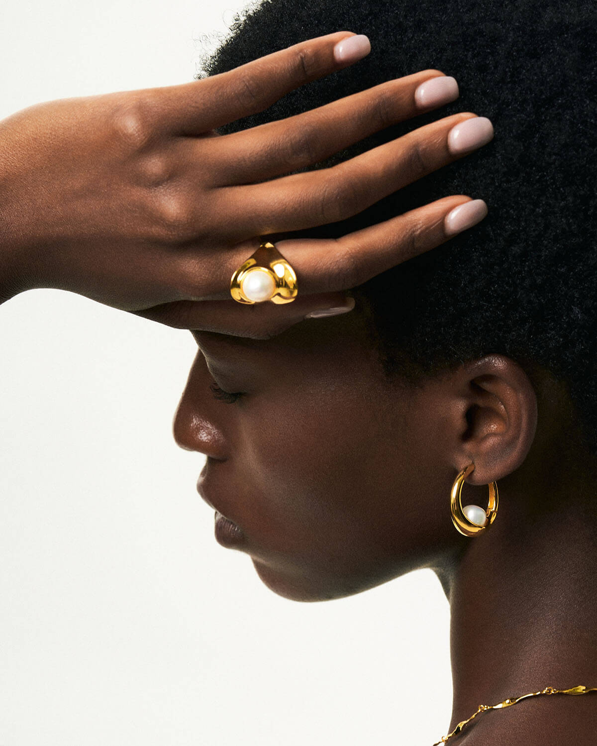 a close up of a person with a ring on their head