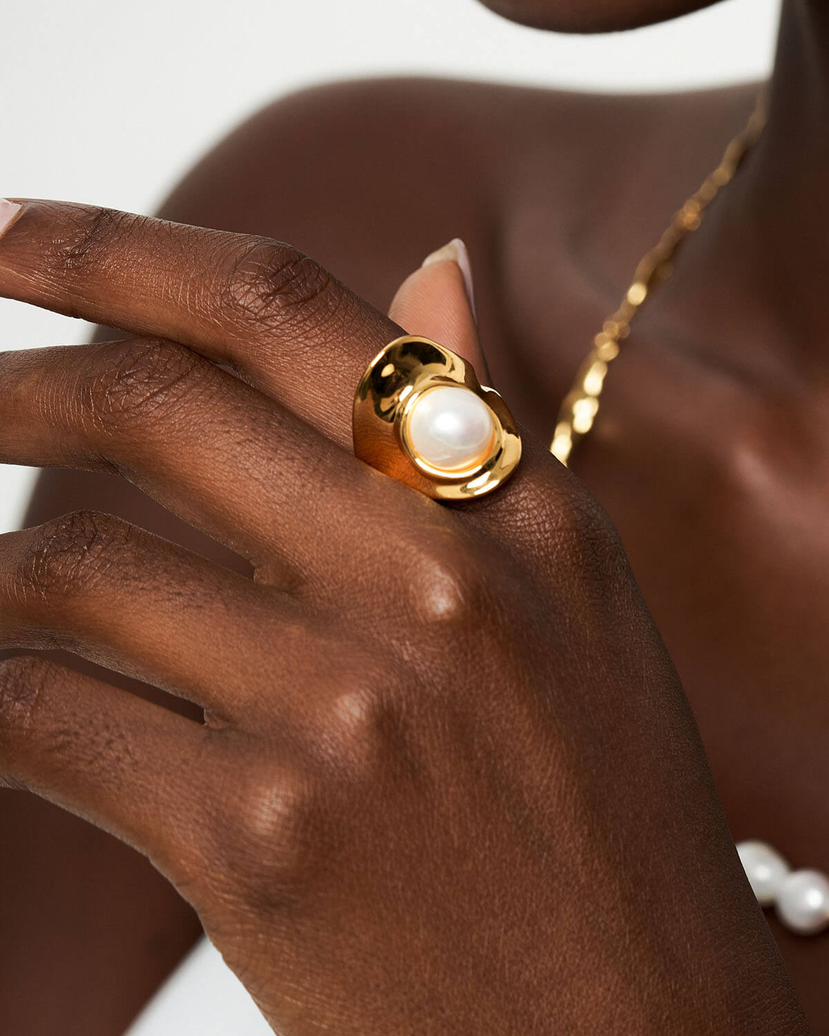 a close up of a person holding a ring