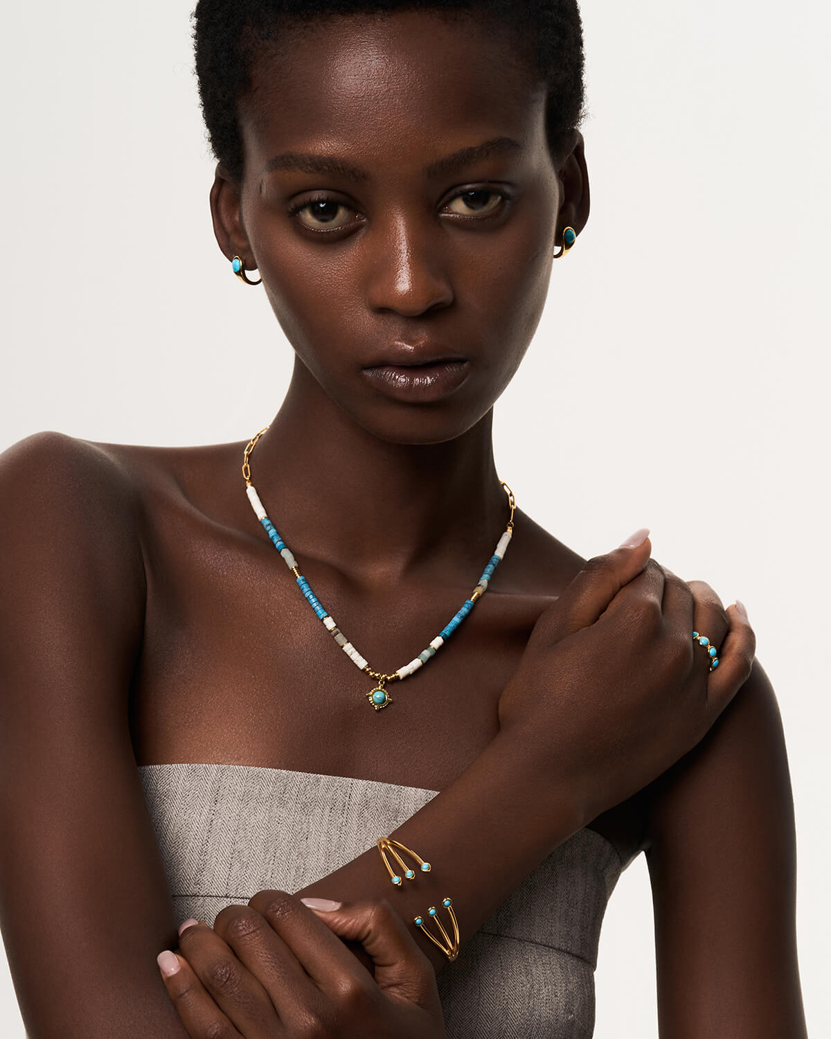 a woman wearing a necklace and bracelet