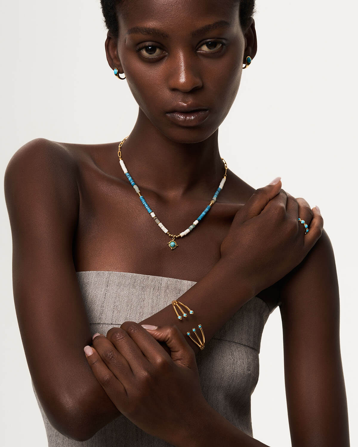 a woman wearing a necklace and bracelet