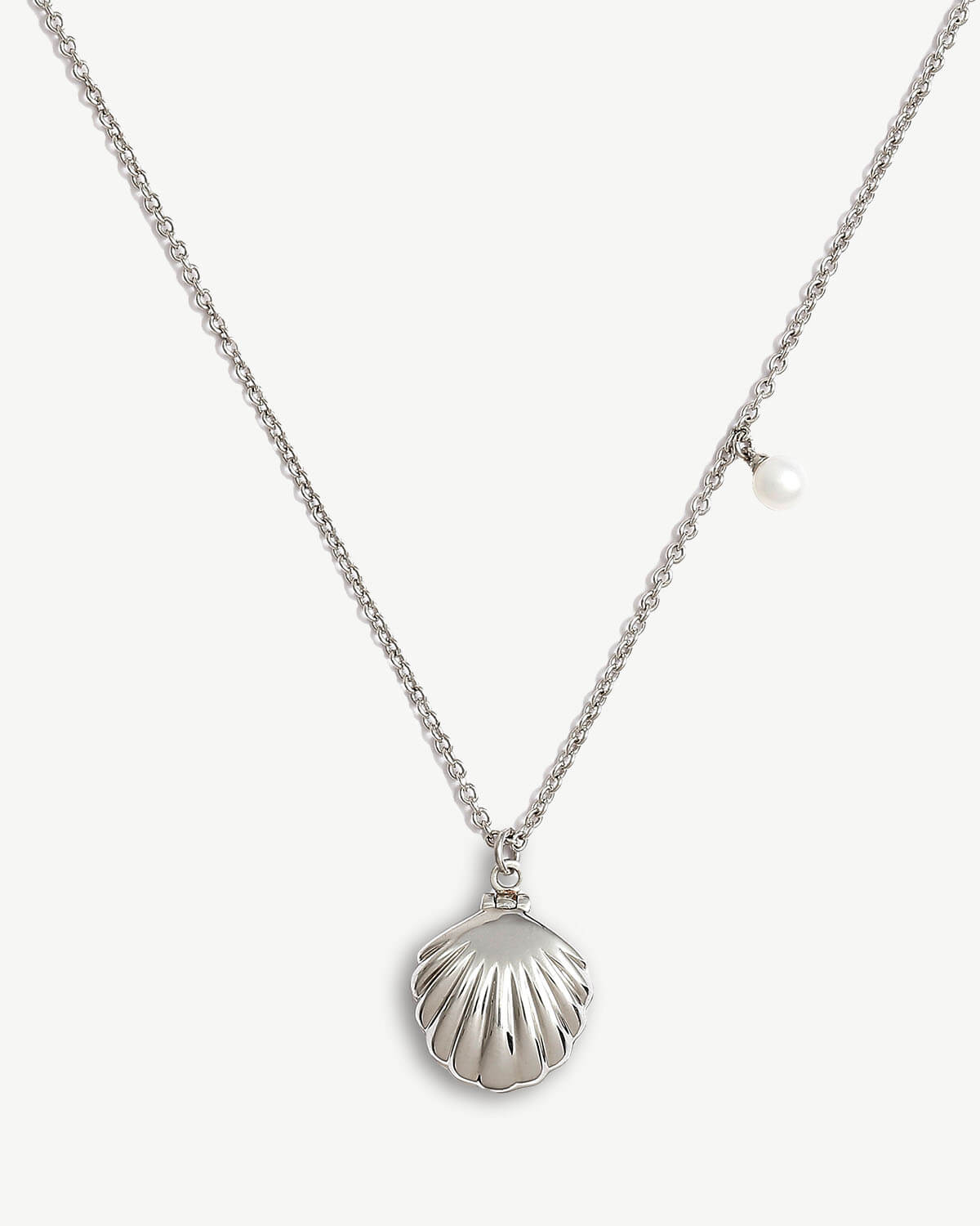 a necklace with a shell and a pearl on it