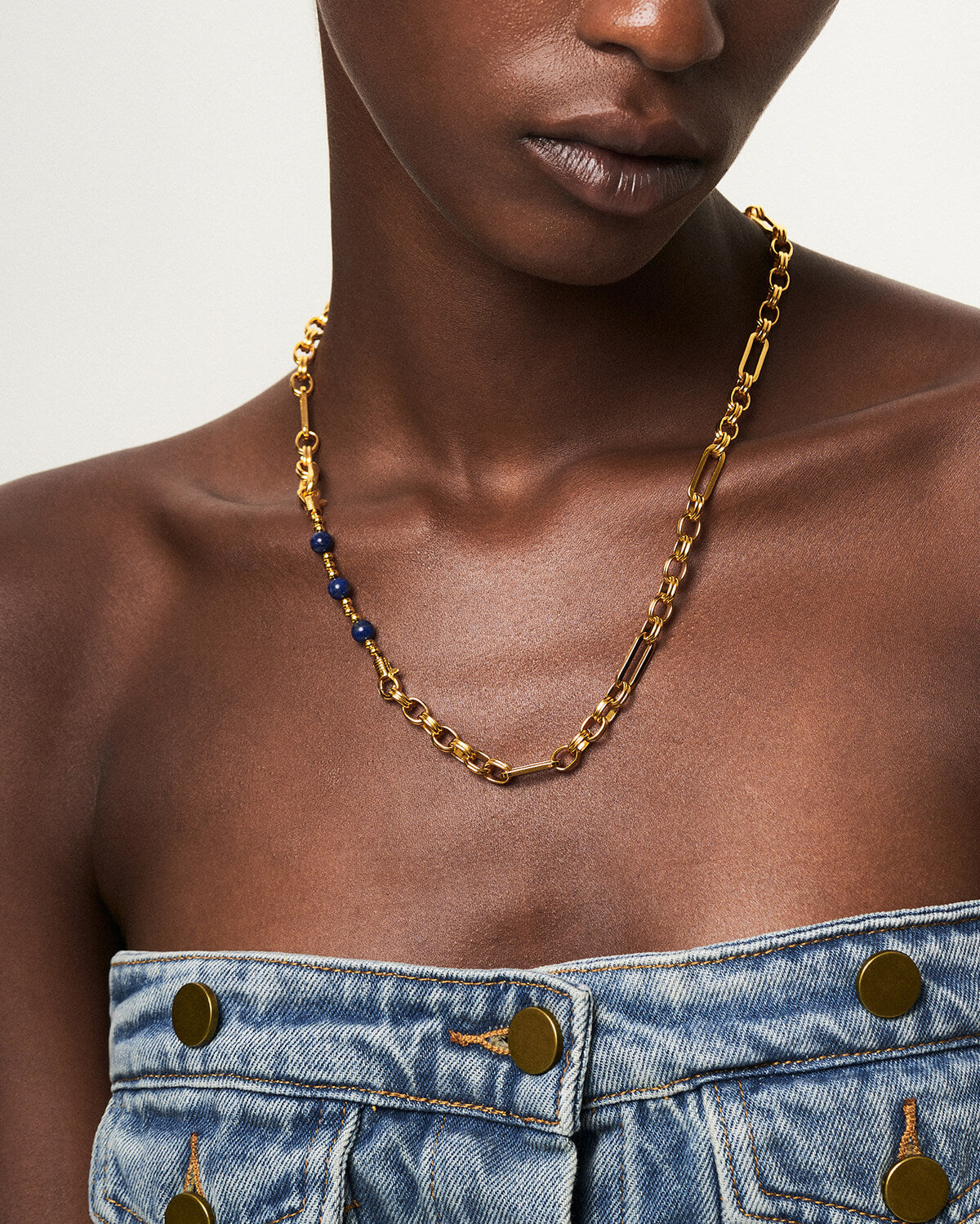 a close up of a person wearing a necklace