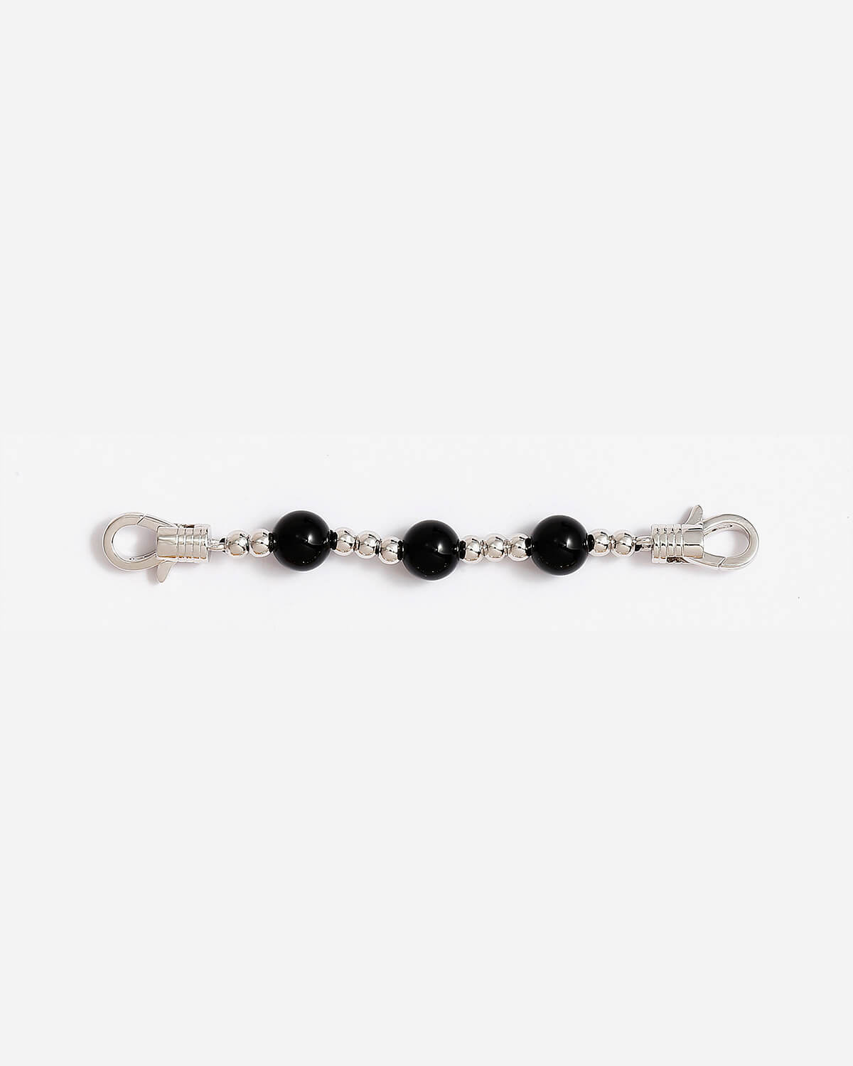 a pair of black beaded bracelets on a white background