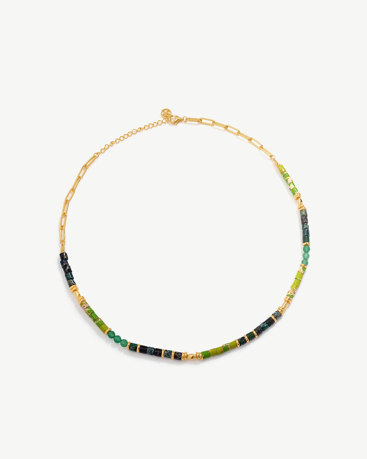 a multicolored beaded necklace on a gold chain