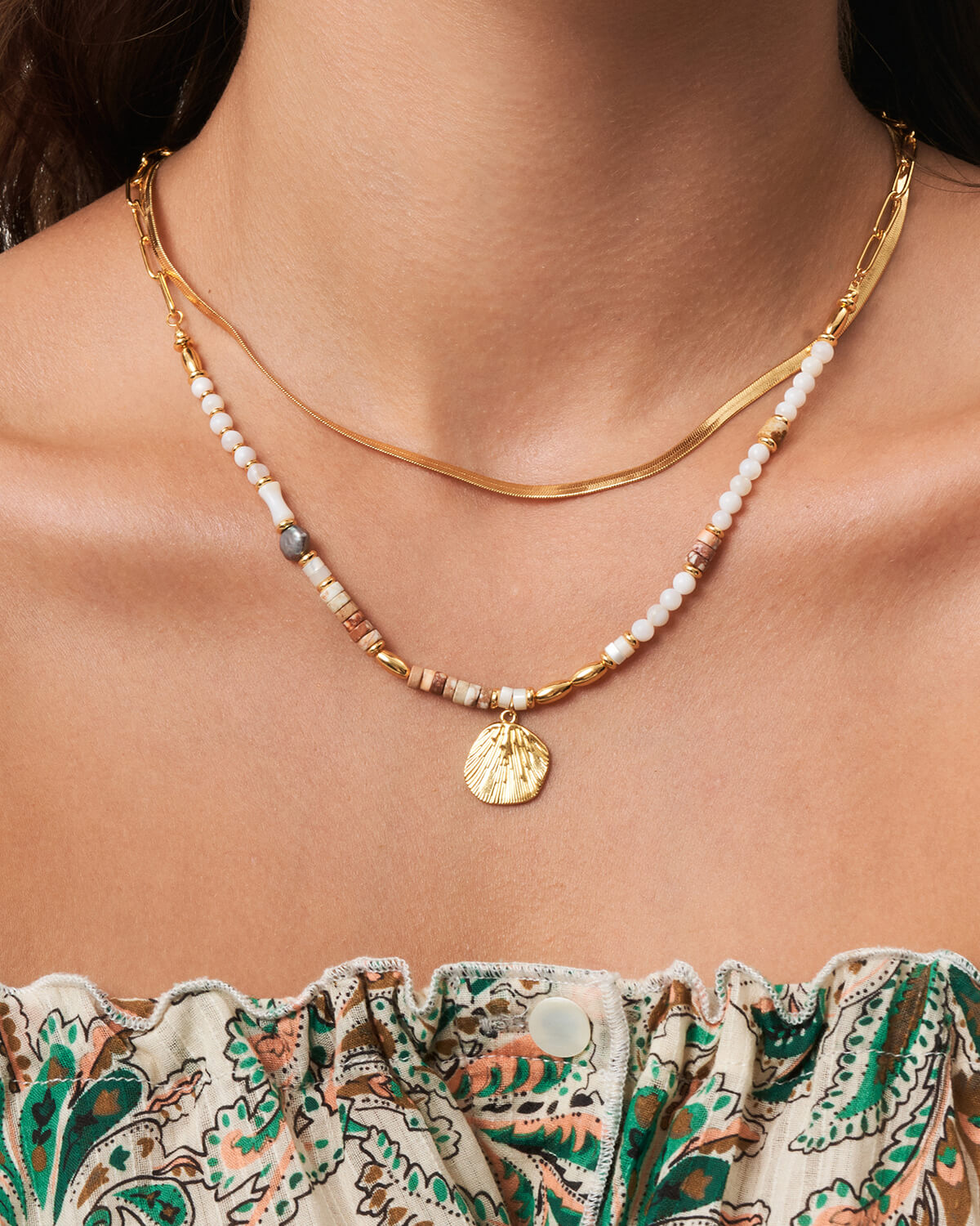 a close up of a woman wearing a necklace