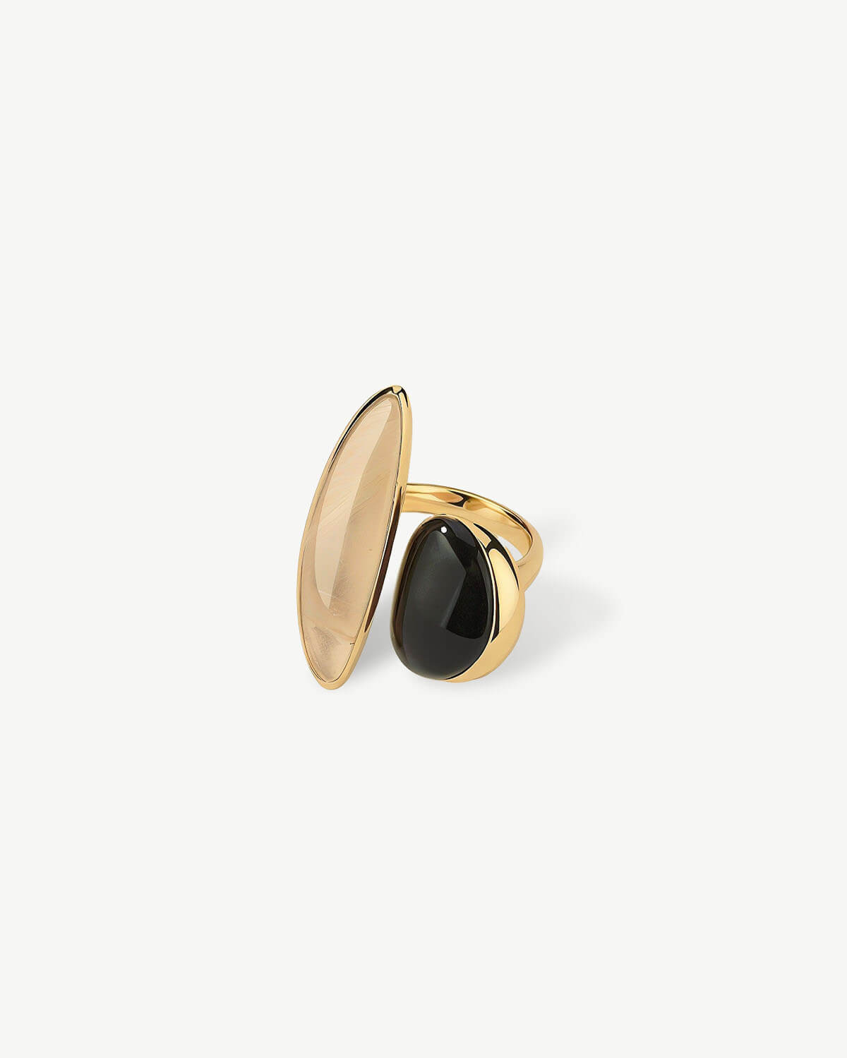 a pair of black and gold rings on a white background