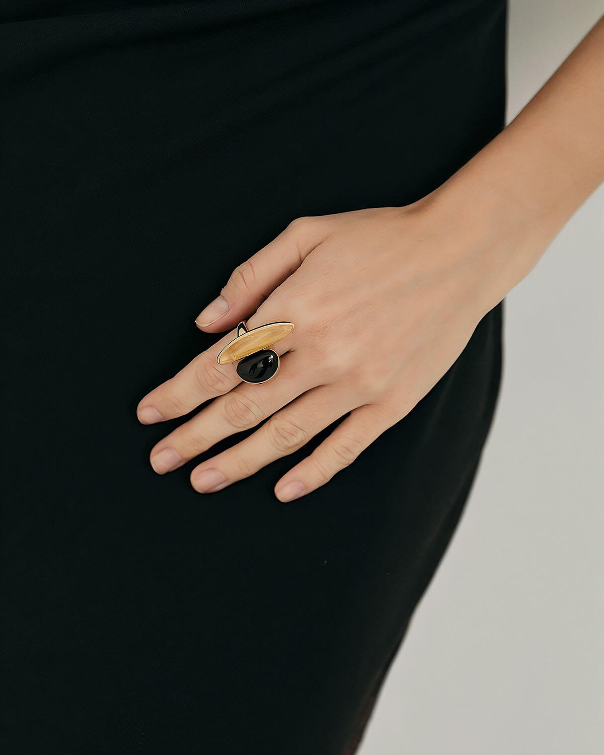 a woman's hand with a ring on it