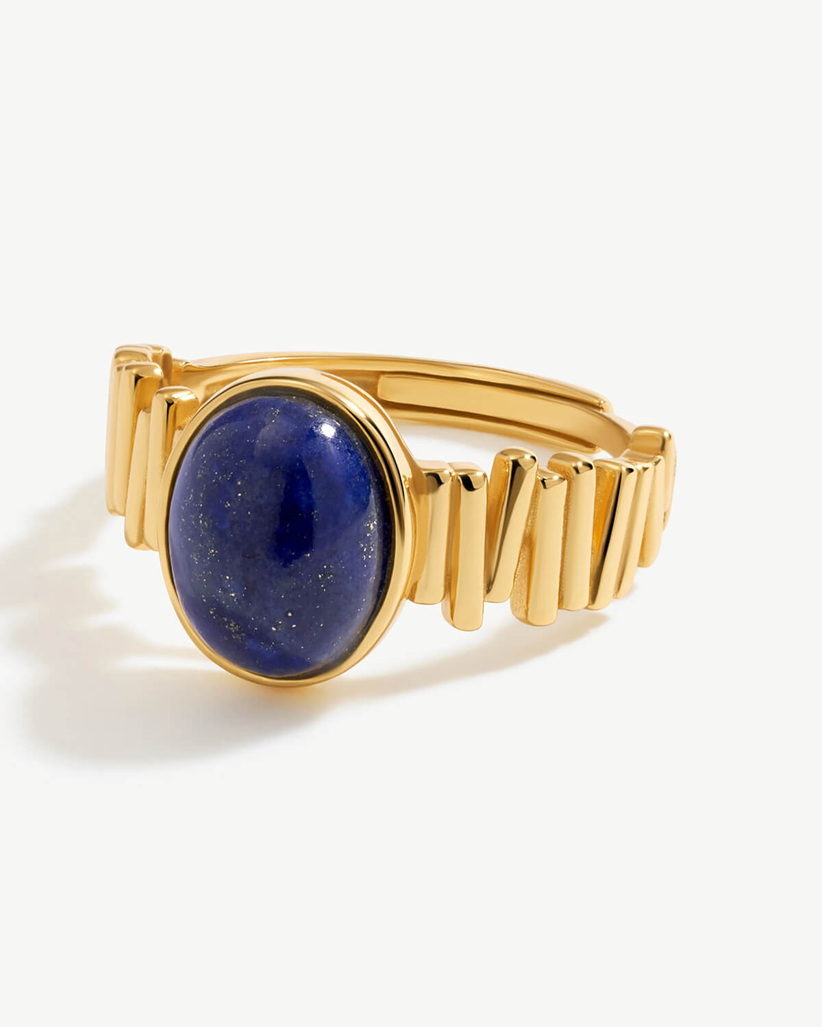 a gold ring with a blue stone on it