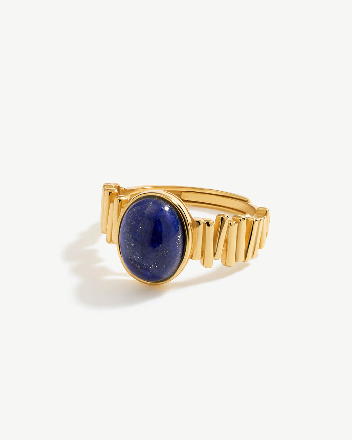 a gold ring with a lapis stone