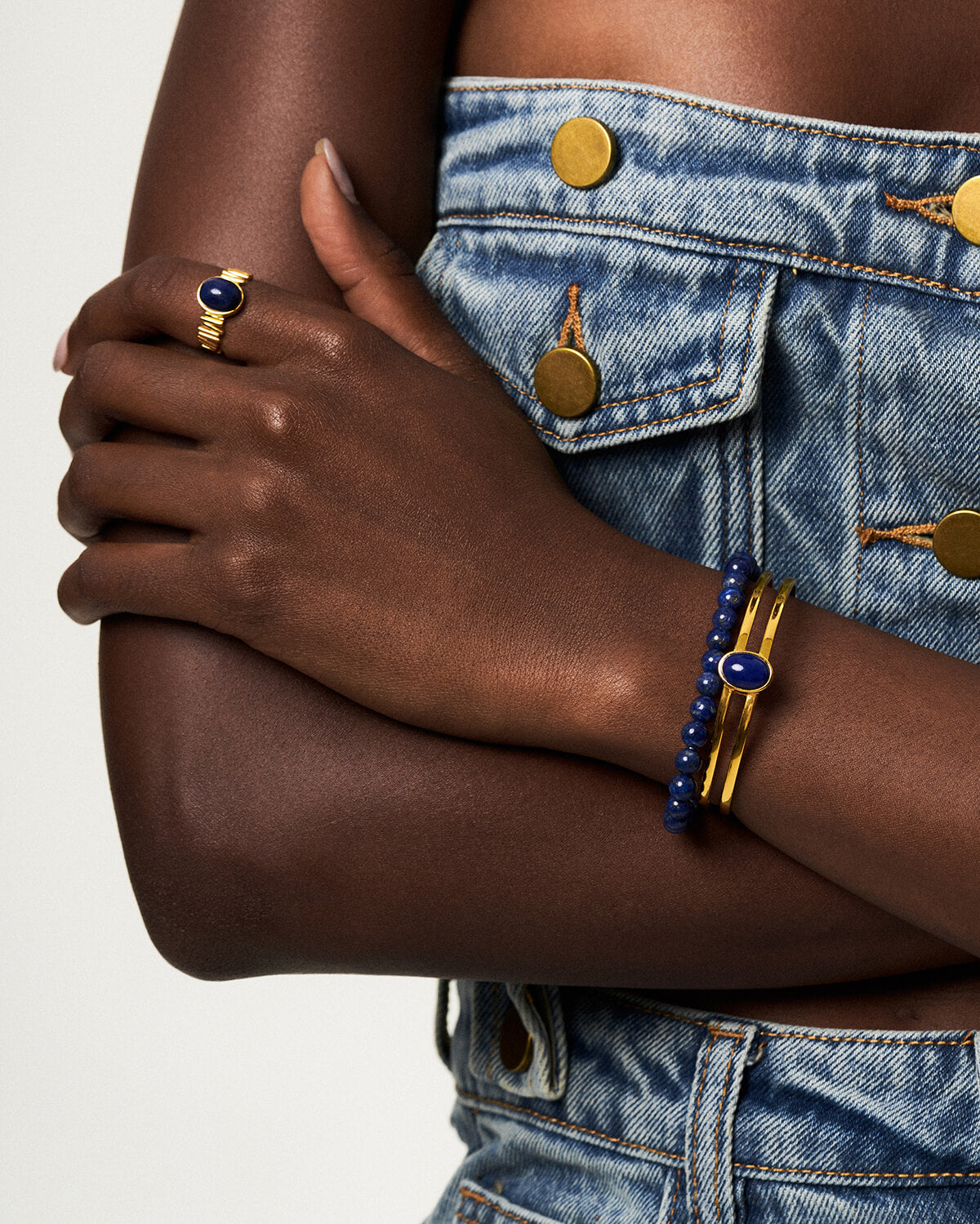 a close up of a person wearing a pair of bracelets