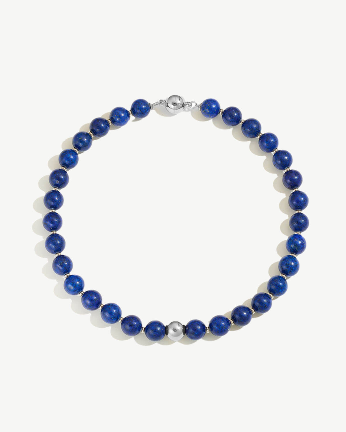 a blue beaded bracelet with a silver clasp