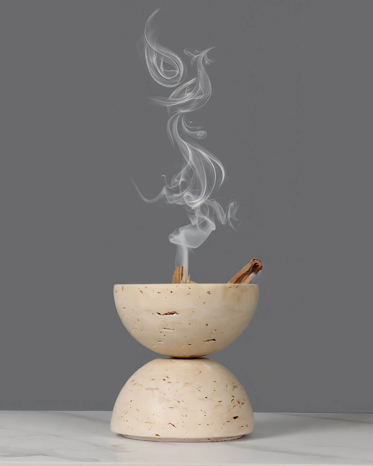 a white bowl with smoke coming out of it