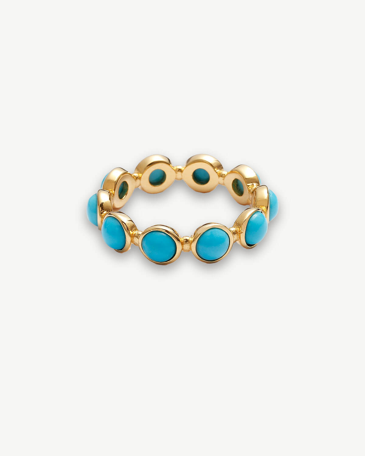 a gold ring with turquoise stones on it