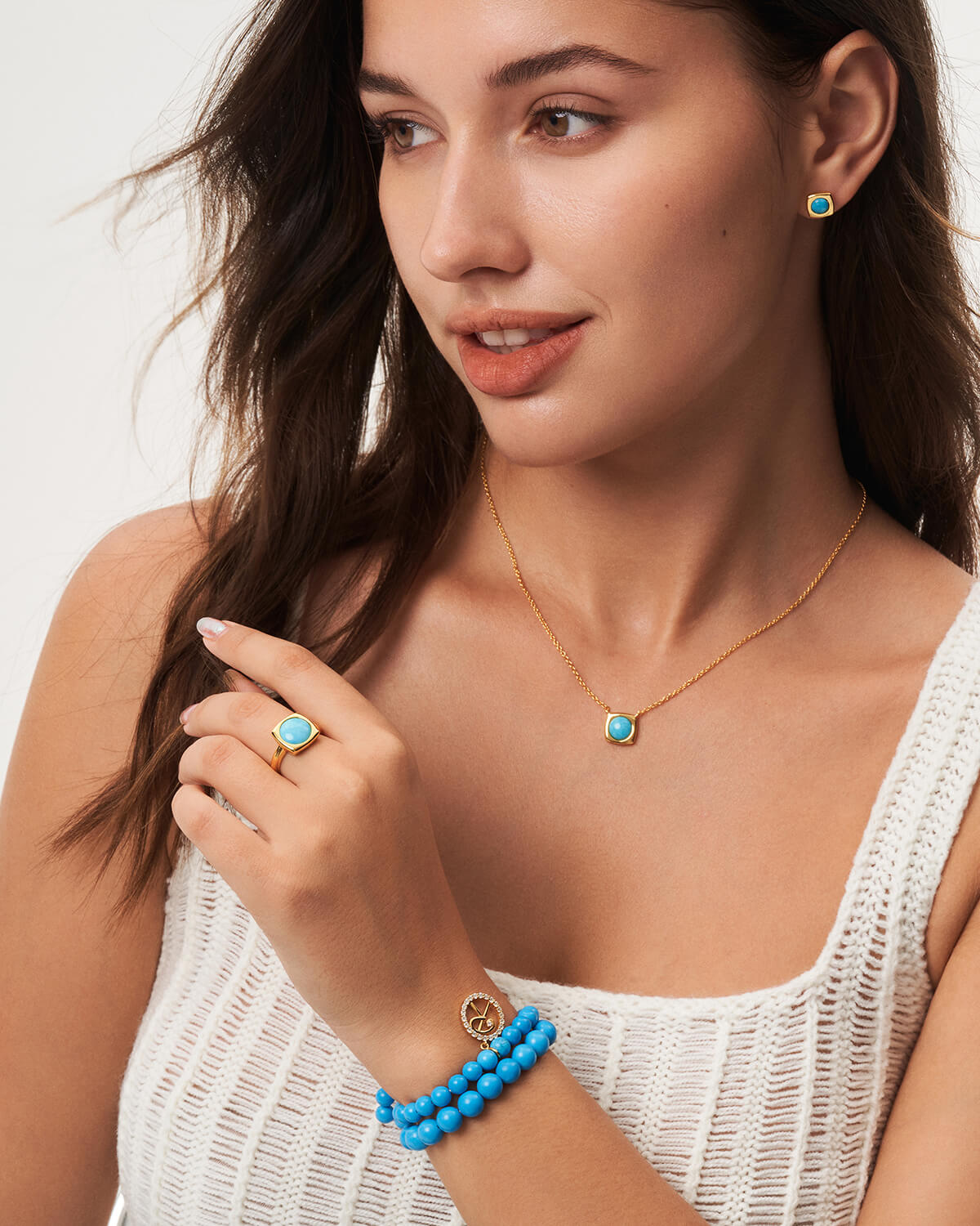 a woman wearing a blue beaded bracelet