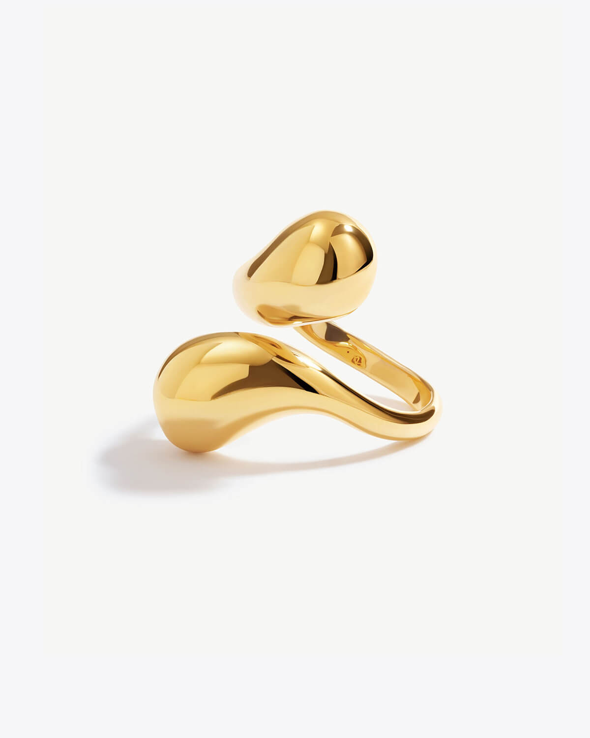 a gold ring on a white background