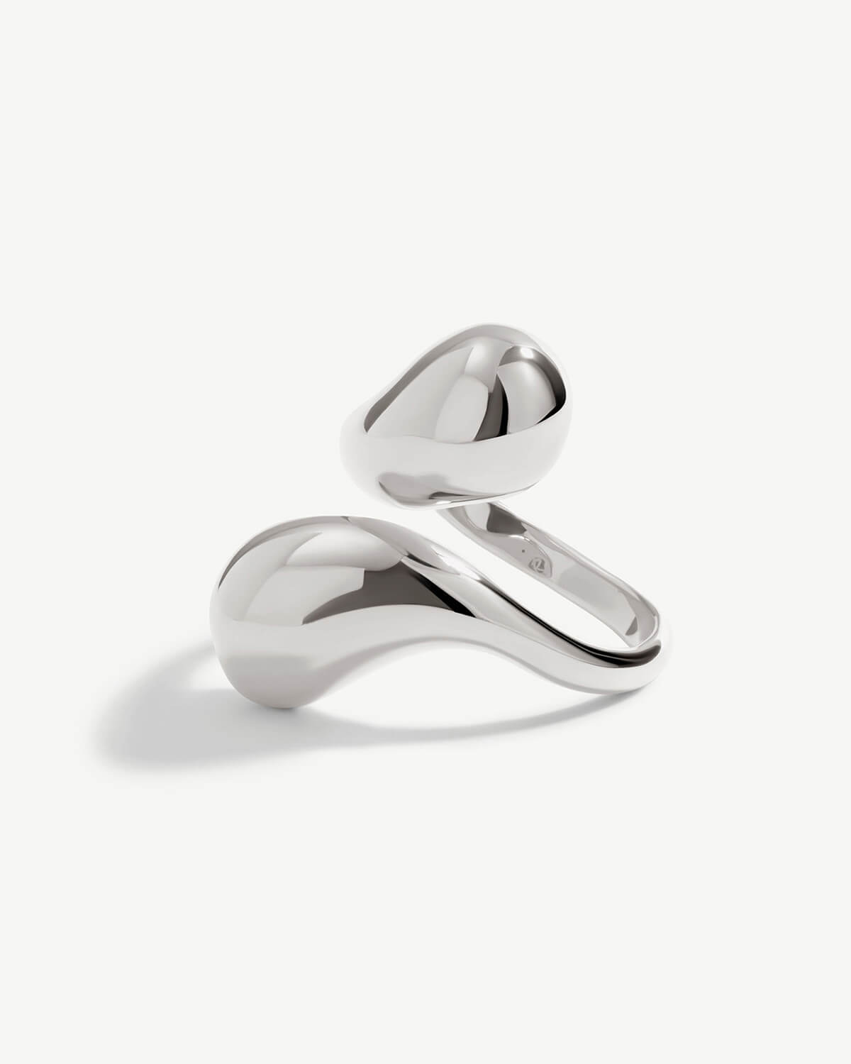 a silver ring on a white background