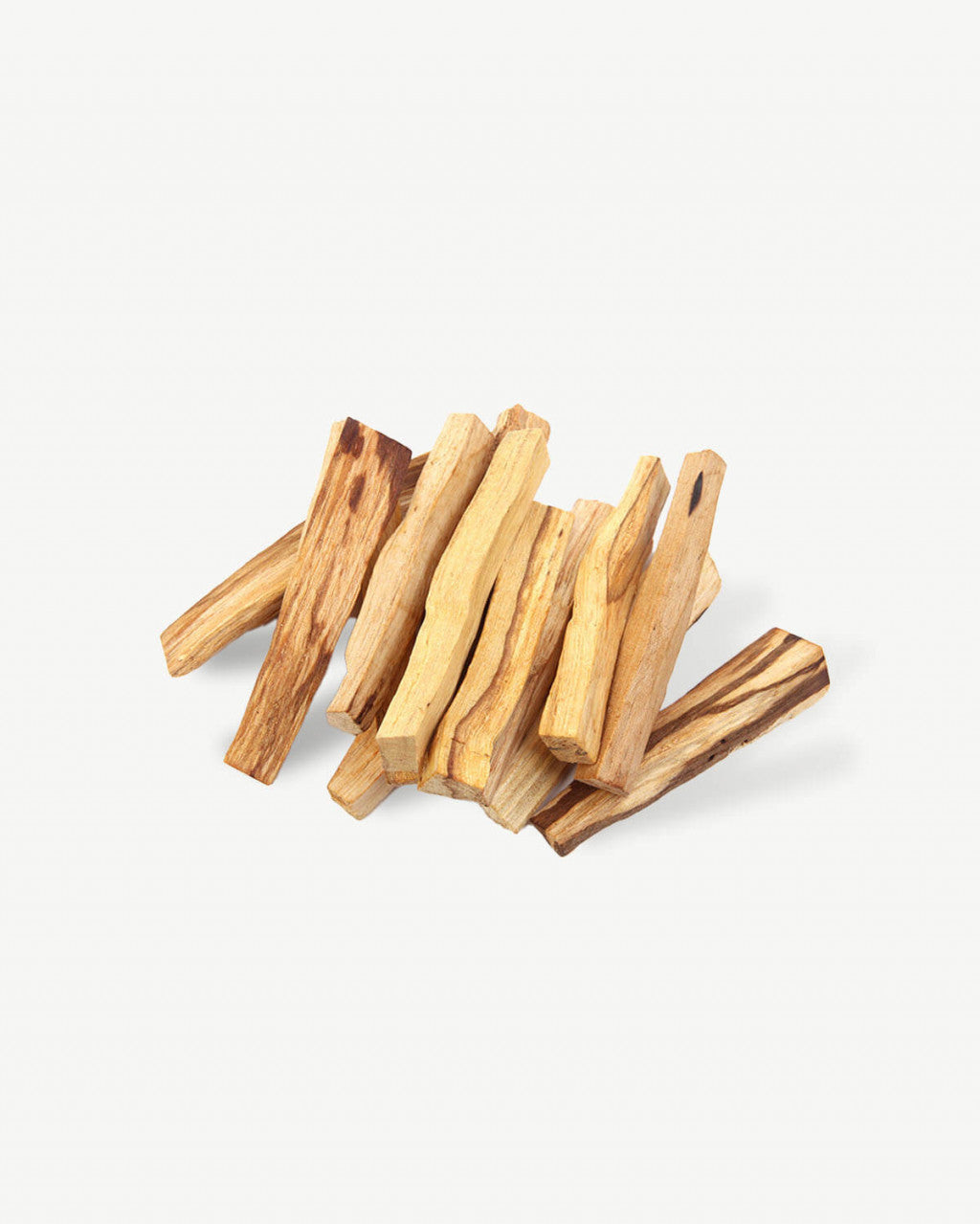 a pile of wood sticks on a white background